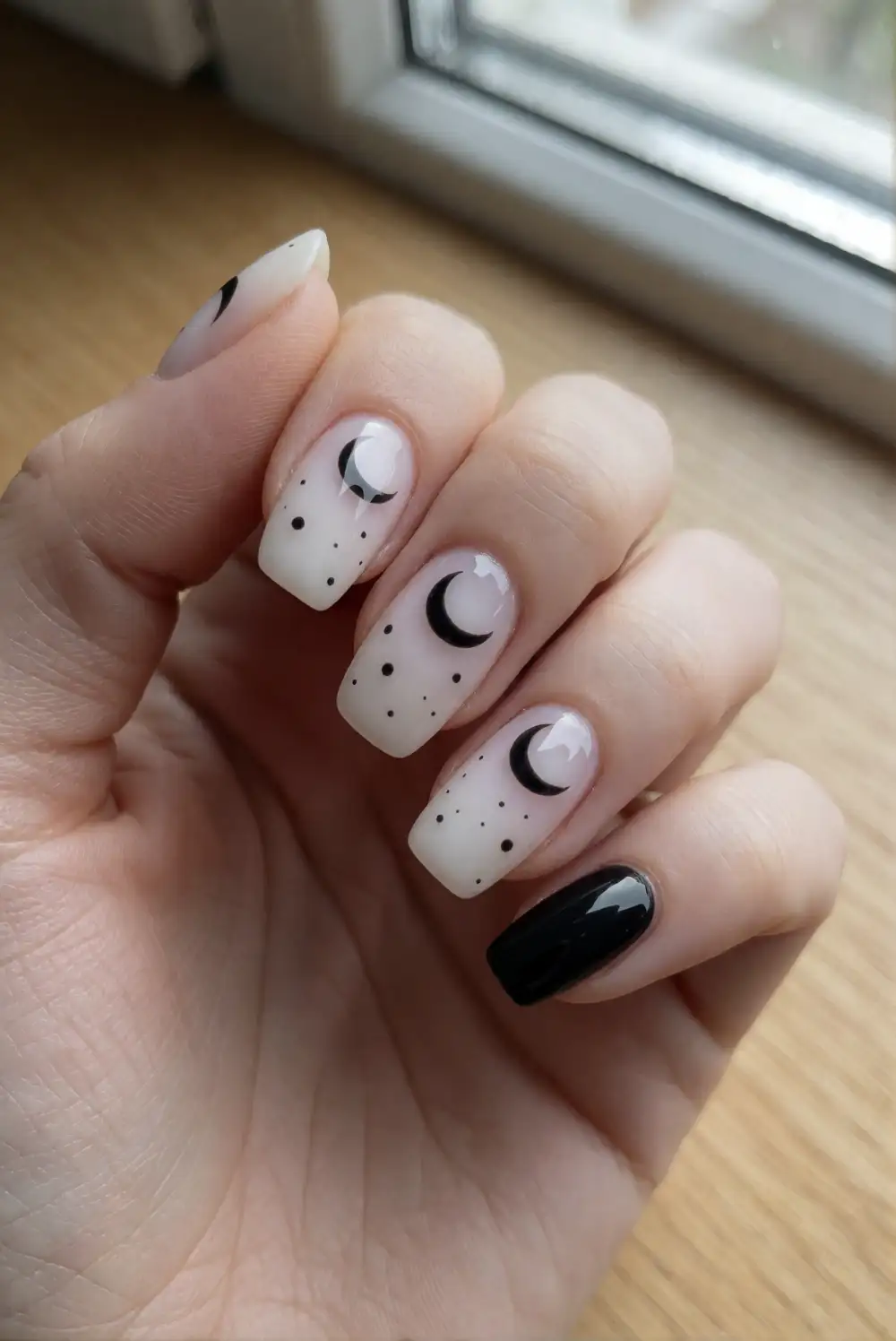 Black Crescent Moons on Milky Nails