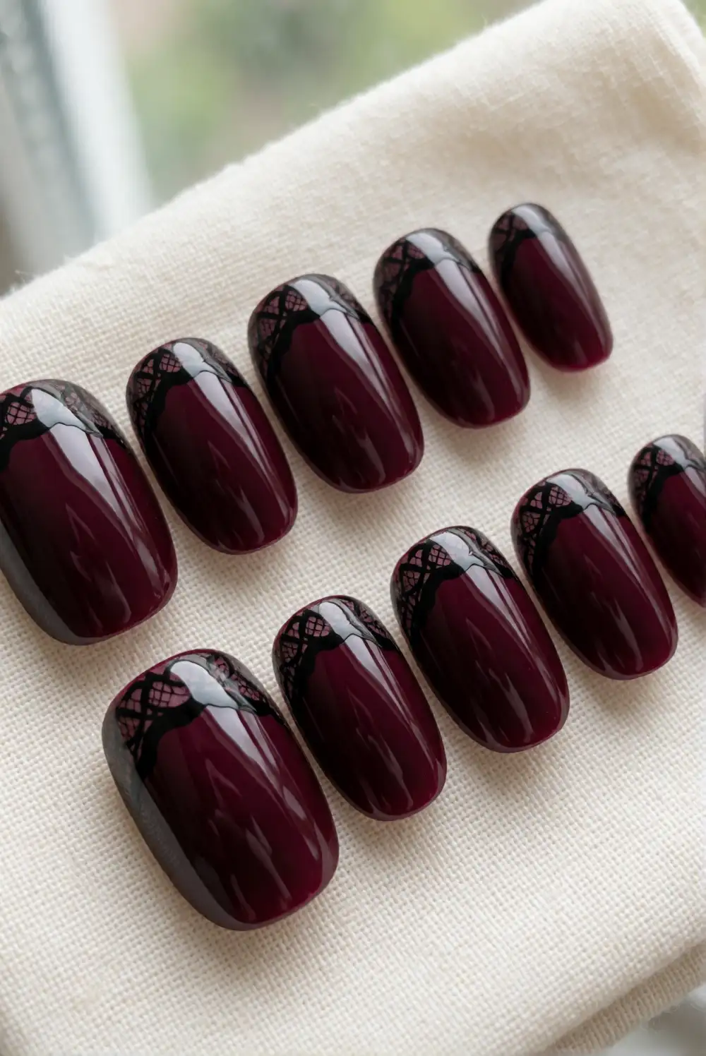 Black Lace Details on Burgundy Nails