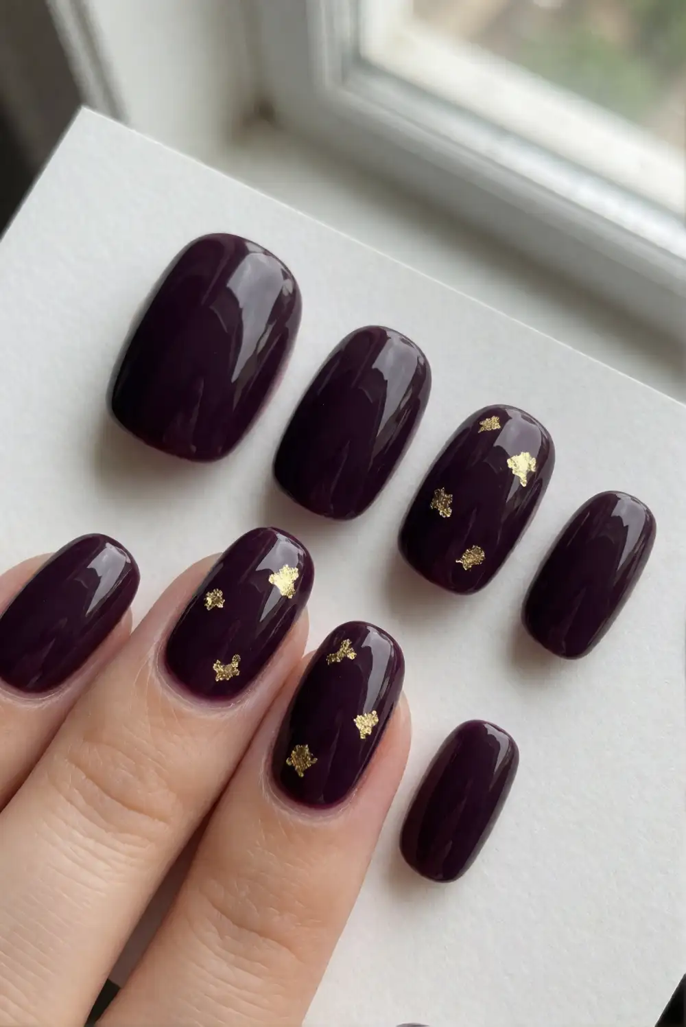 Deep Plum Nails With Gold Foil Flecks