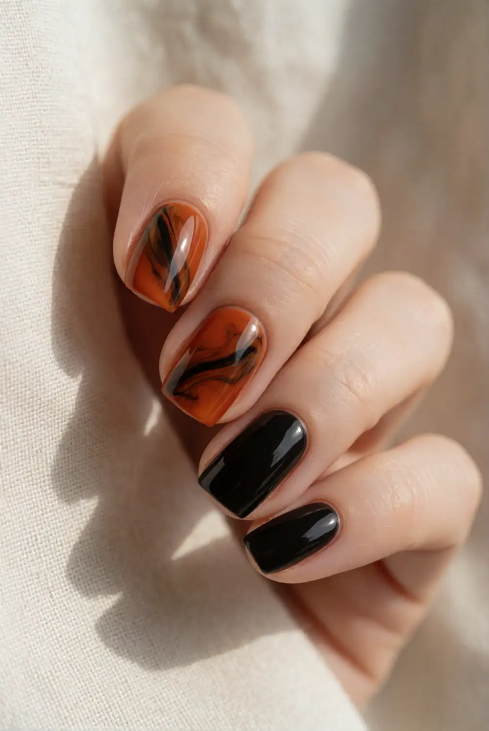 Smoky Orange and Black Marble Nails